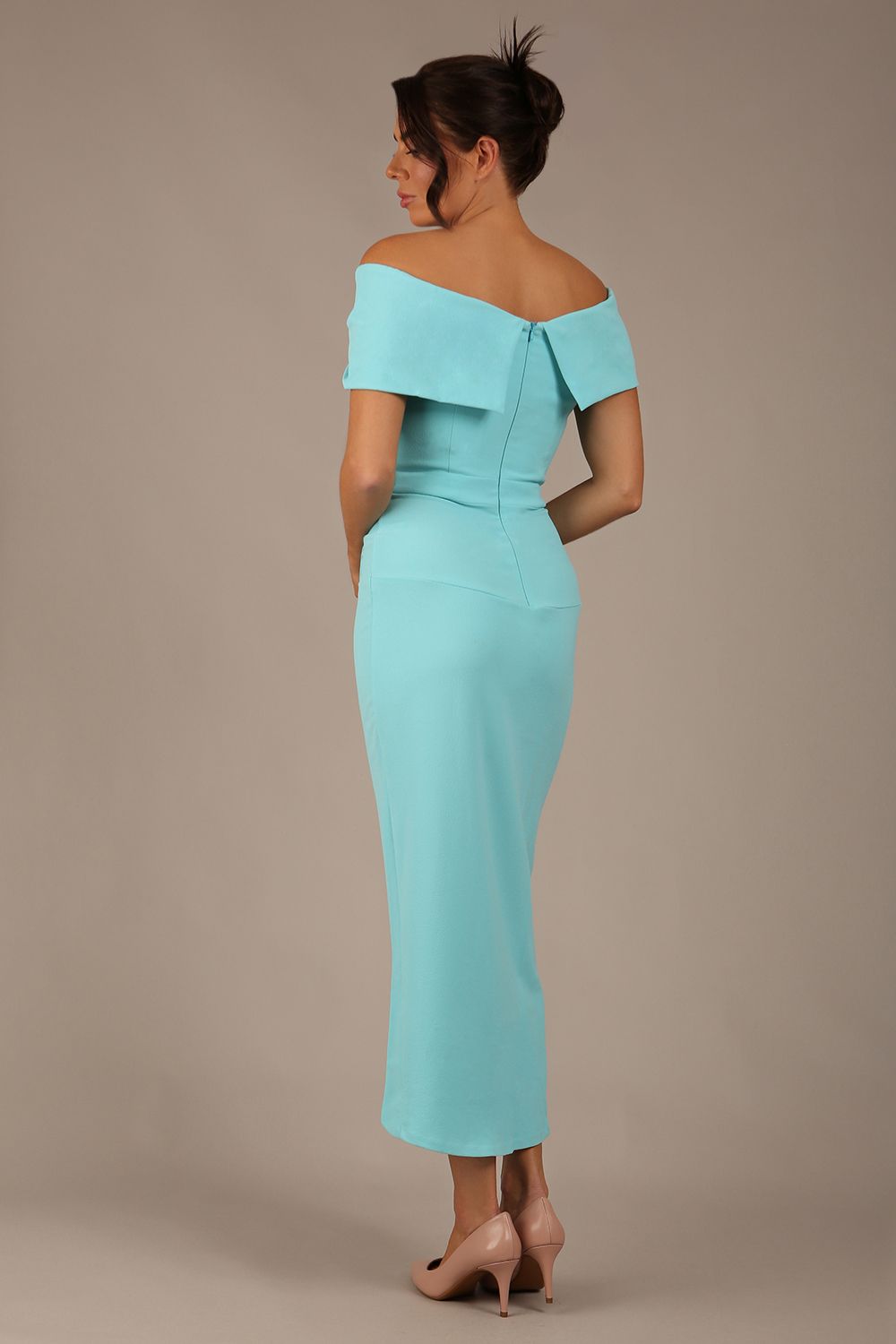 brunette model wearing diva catwalk vegas calf length turquoise midaxi dress with wide bardot neckline and open shoulders with a large opening at the front of the skirt with pleating coming down long skirt front (Turquoise)