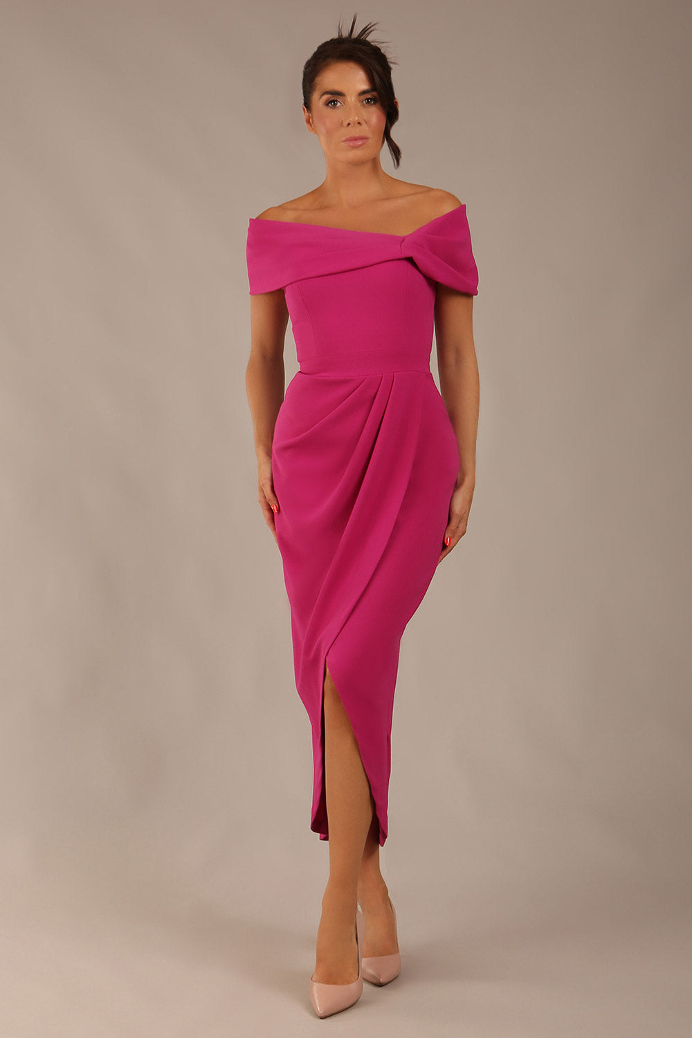 model wearing diva catwalk vegas calf length magenta midaxi dress with wide bardot neckline and open shoulders with a large opening at the front of the skirt with pleating coming down long skirt front (Magenta)