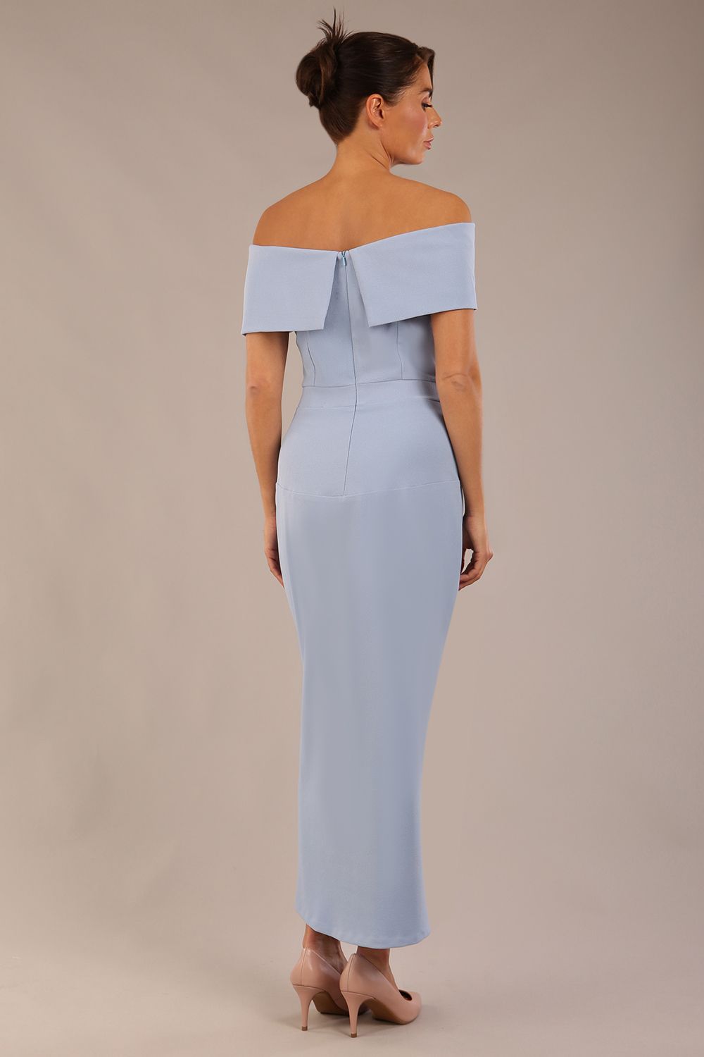 brunette model wearing diva catwalk vegas calf length powder blue midaxi dress with wide bardot neckline and open shoulders with a large opening at the front of the skirt with pleating coming down long skirt front (Powder Blue)