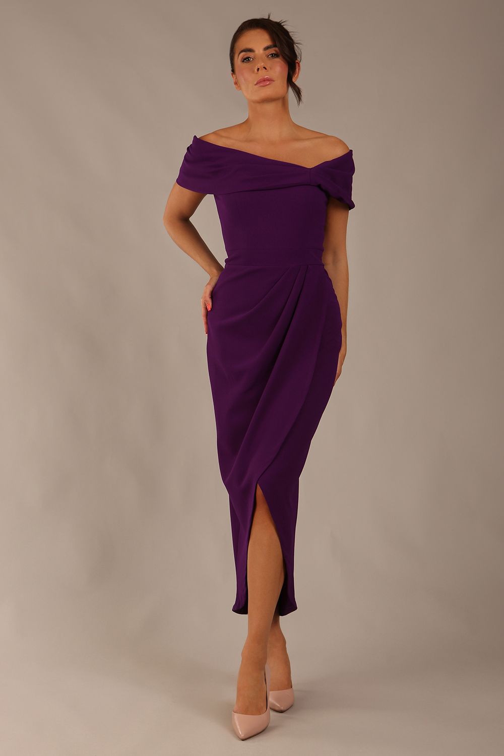 brunette model wearing diva catwalk vegas calf length passion purple midaxi dress with wide bardot neckline and open shoulders with a large opening at the front of the skirt with pleating coming down long skirt front (Passion Purple)