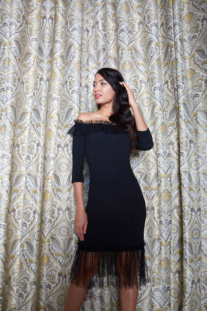 Brunette Model wearing Diva Catwalk Lyrical Pencil Knee length three quarter sleeve off-shoulder Bardot neckline Dress with lace detail around the bottom of the skirt in Black front