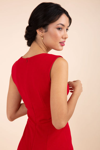 brunette model wearing diva catwalk pencil-skirt red dress with v-neckline and pleating across the tummy without sleeves front