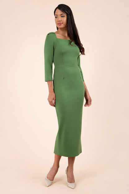 brunette model wearing diva catwalk maxi plain three quarter sleeve dress with pleating on shoulders and square neckline in vineyard green front