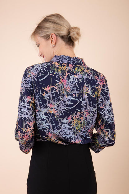Model wearing the Diva floral top in navy blue front image