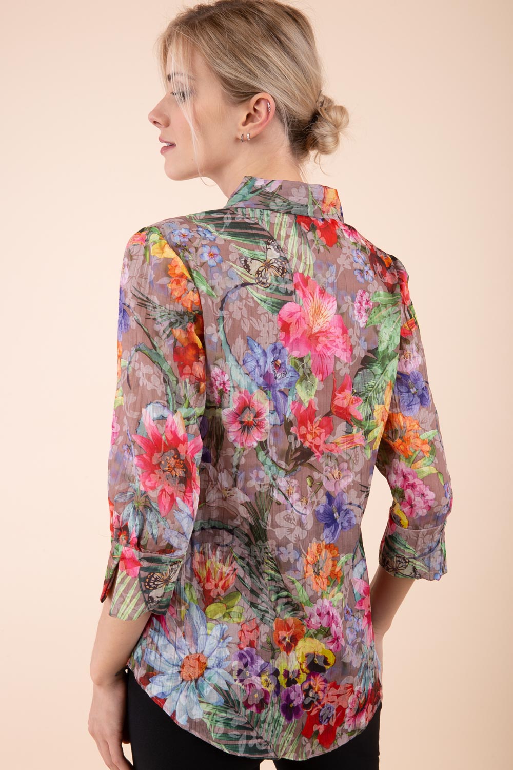 Model is wearing the Diva Branscombe 3/4 Sleeve blouse in floral print taupe front image 