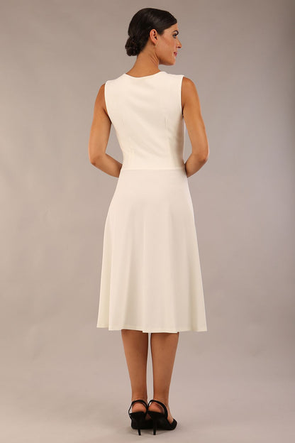 model wearing Diva Catwalk Patina A-line Swing Sleeveless dress with v-neckline with detail in Ivory-White colour 