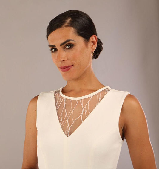 model wearing Diva Catwalk Patina A-line Swing Sleeveless dress with v-neckline with detail in Ivory-White colour 