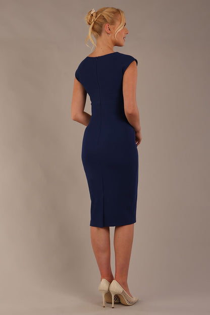 model wearing diva catwalk lydia sleeveless pencil flattering fitted plain dress with split neckline and pleating across the body in navy blue sheath dress front (Navy Blue)