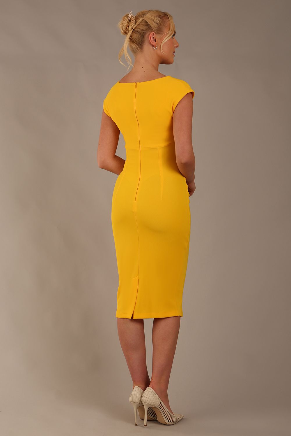 model wearing diva catwalk lydia sleeveless pencil flattering fitted plain dress with split neckline and pleating across the body in spectra yellow front (Spectra Yellow)