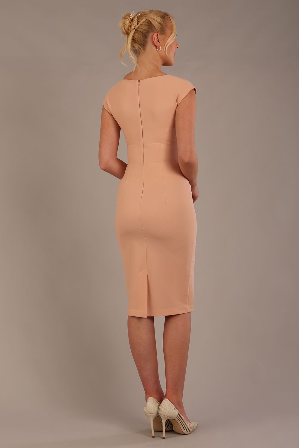 model wearing diva catwalk lydia sleeveless pencil flattering fitted plain dress with split neckline and pleating across the body in almond mousse sheath dress front (Almond Mousse)