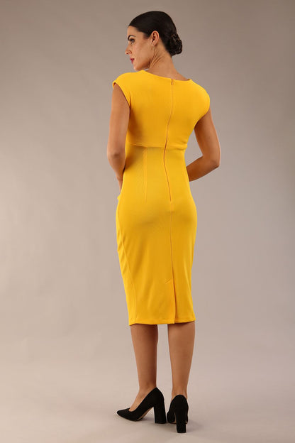 model wearing diva catwalk lydia sleeveless pencil flattering fitted plain dress with split neckline and pleating across the body in spectra yellow front (Spectra Yellow)