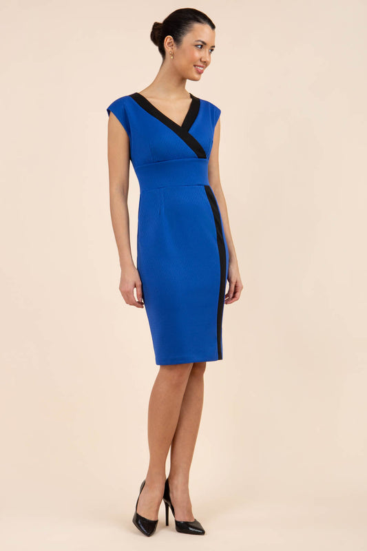 brunette model wearing Diva catwalk Suzy pencil sleeveless dress with v-neckline and wide wasteland in cobalt blue front
