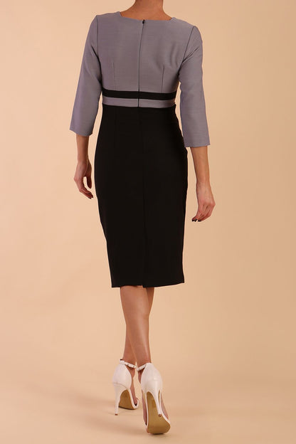 A model is wearing a three quarter sleeve colour block pencil dress by Diva Catwalk in Black and grey colour
