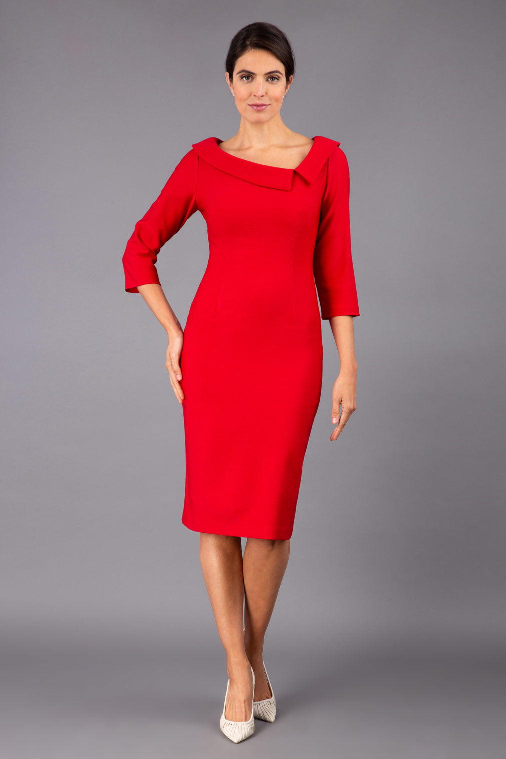 Model wearing Diva catwalk Opulus pencil dress in cardinal red with three quarter sleeve figure fitted front image