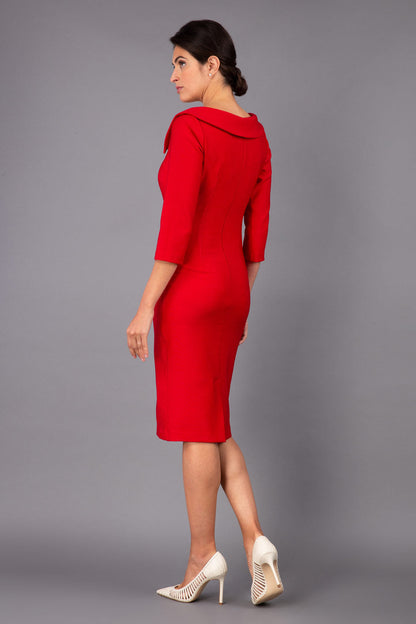 Model wearing Diva catwalk Opulus pencil dress in cardinal red with three quarter sleeve figure fitted front image