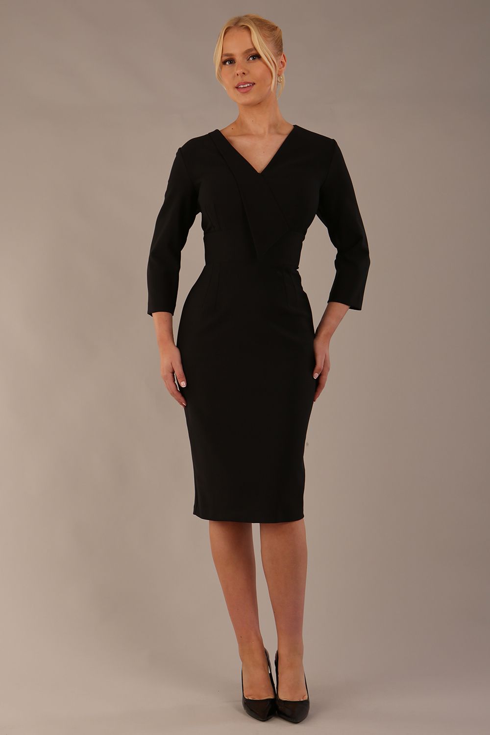 model wearing diva catwalk cranston pencil-skirt dress with low v-neck and tie detail wide band with sleeves in black colour front side (Black)