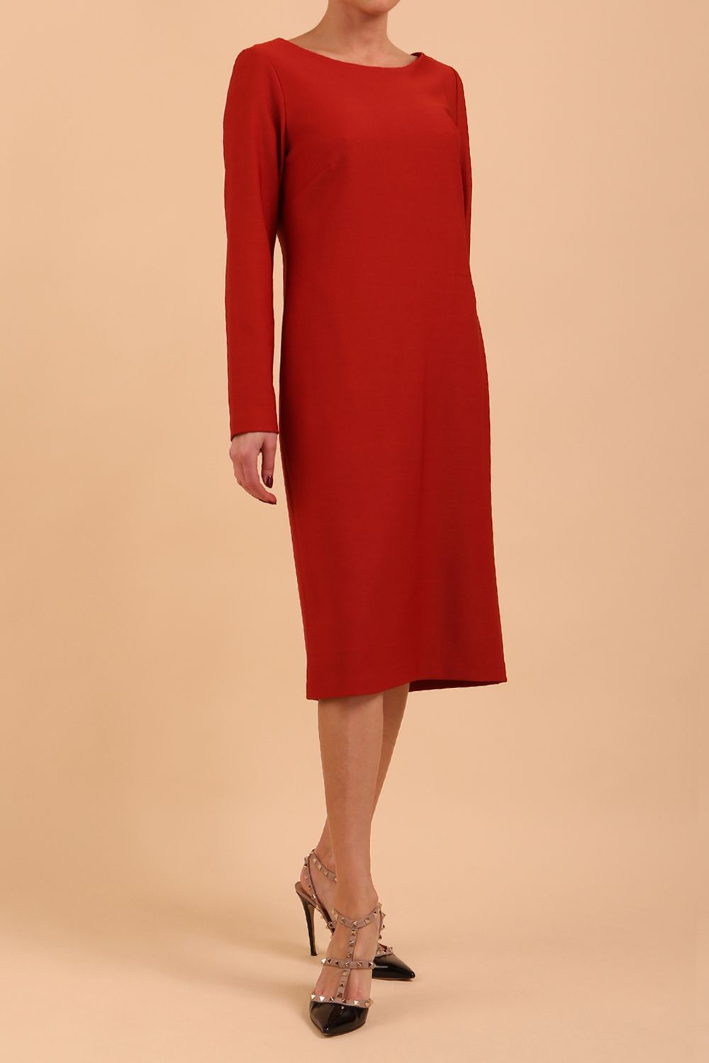 brunette model wearing diva catwalk cora white pencil dress with long sleeves and rounded neckline with pockets in colour garnet red on side front