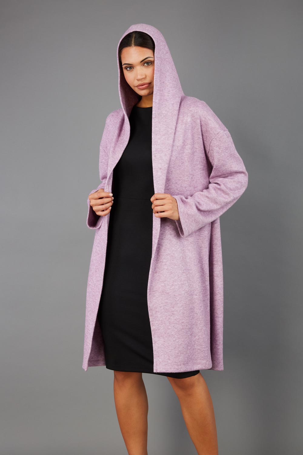 brunette model wearing diva catwalk hooded coat with long sleeves in soft cosy cashmere in pink front