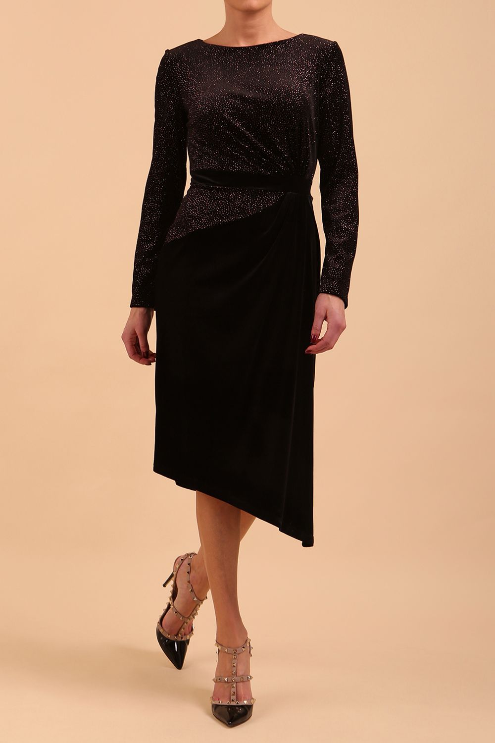 Brunette Model wearing assymetric glitter and black velvet long sleeve dress front image