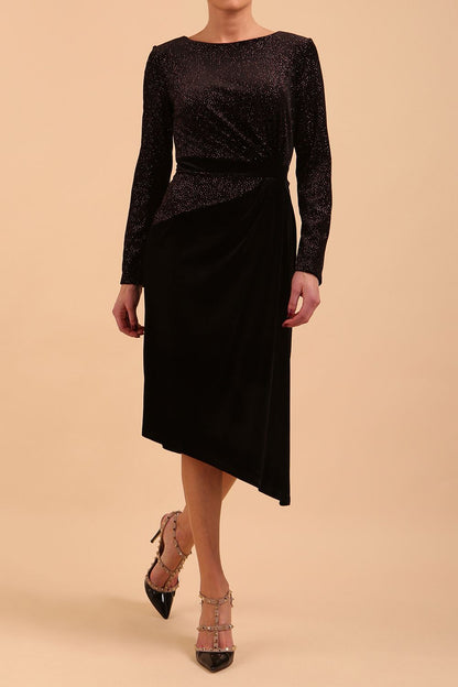 Brunette Model wearing assymetric glitter and black velvet long sleeve dress front image