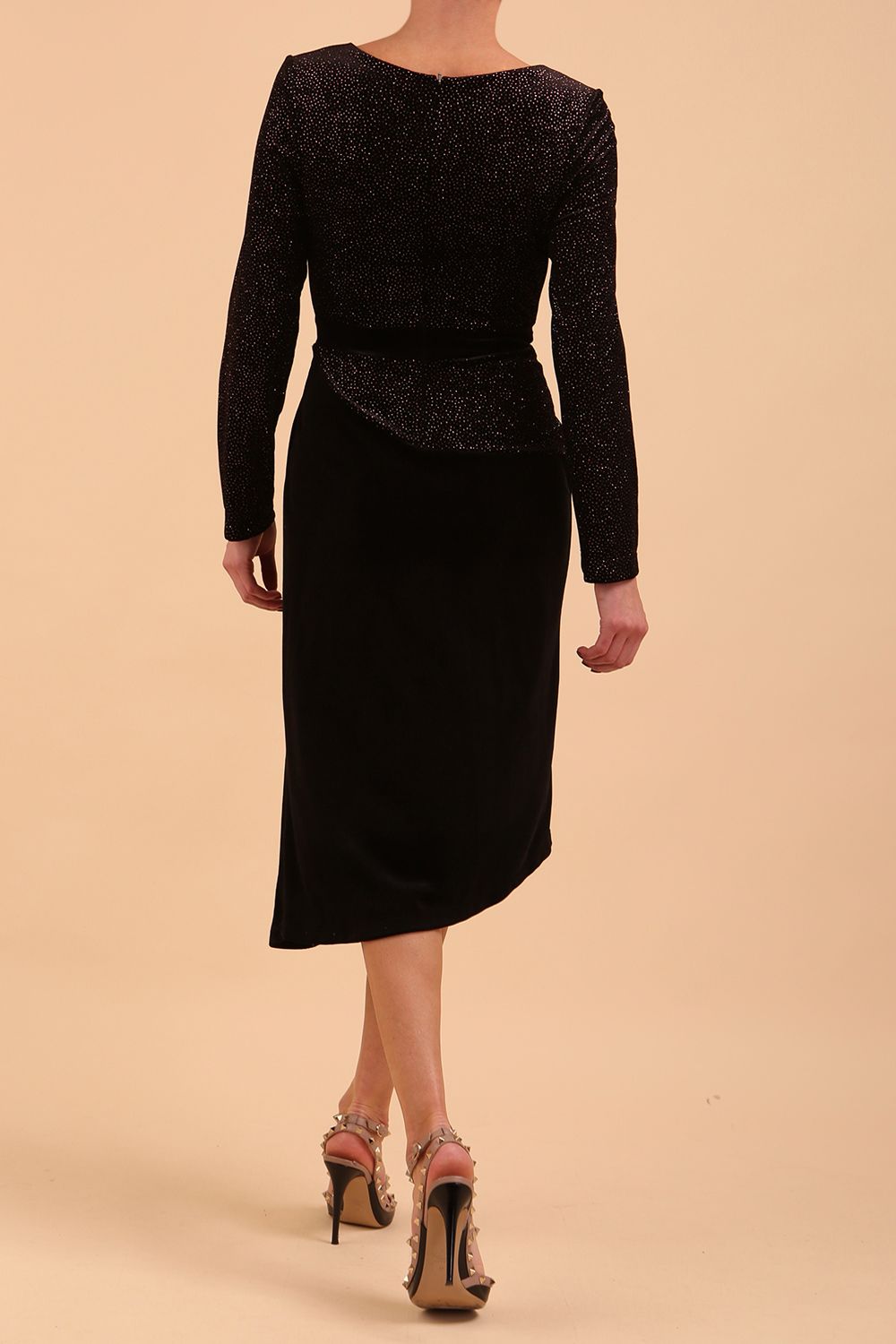 Brunette Model wearing assymetric glitter and black velvet long sleeve dress front image