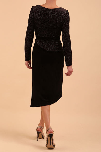 Brunette Model wearing assymetric glitter and black velvet long sleeve dress front image