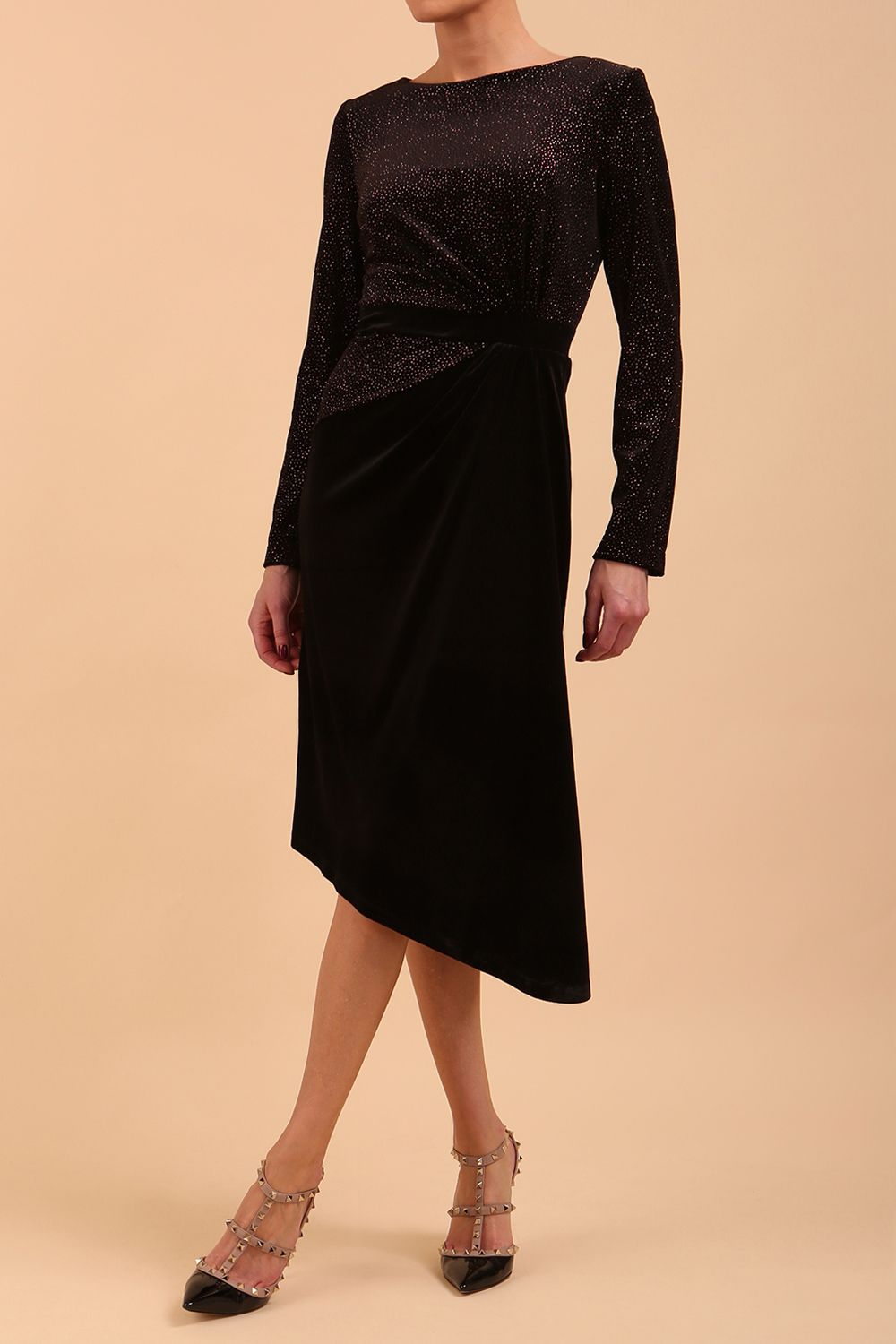 Brunette Model wearing assymetric glitter and black velvet long sleeve dress front image