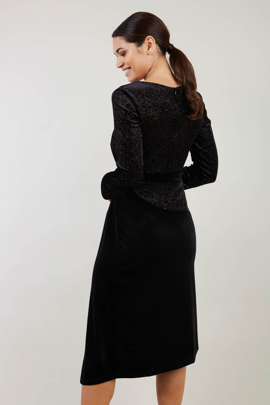 Brunette Model wearing assymetric glitter and black velvet long sleeve dress front image