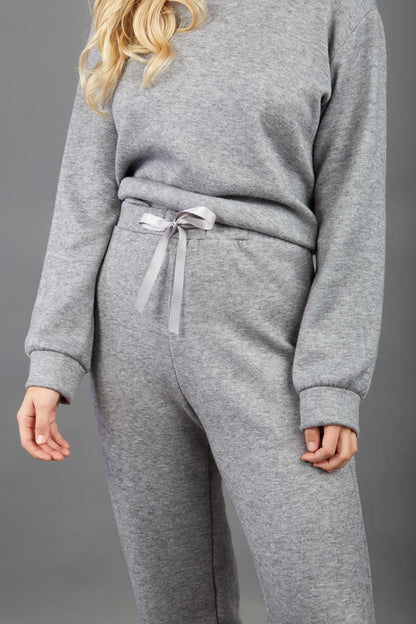 model wearing diva catwalk cosy soft touch cashmere joggers long leg with ribbon detail in flint grey back