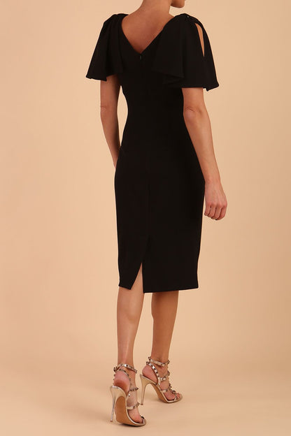 brunette model is wearing diva catwalk hermione pencil dress with tie shoulder details and empire waistline in black front