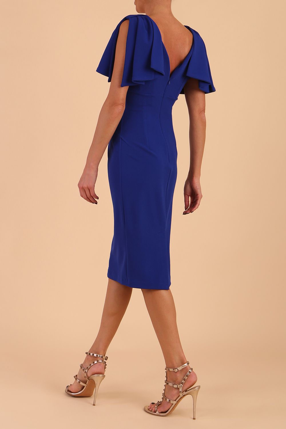 brunette model is wearing diva catwalk hermione pencil dress with tie shoulder details and empire waistline in cobalt blue front