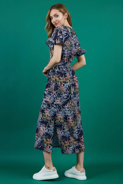 brunette model is wearing diva catwalk carella short sleeve printed midi dress with a belt in navy floral print front