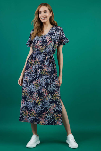 brunette model is wearing diva catwalk carella short sleeve printed midi dress with a belt in navy floral print front