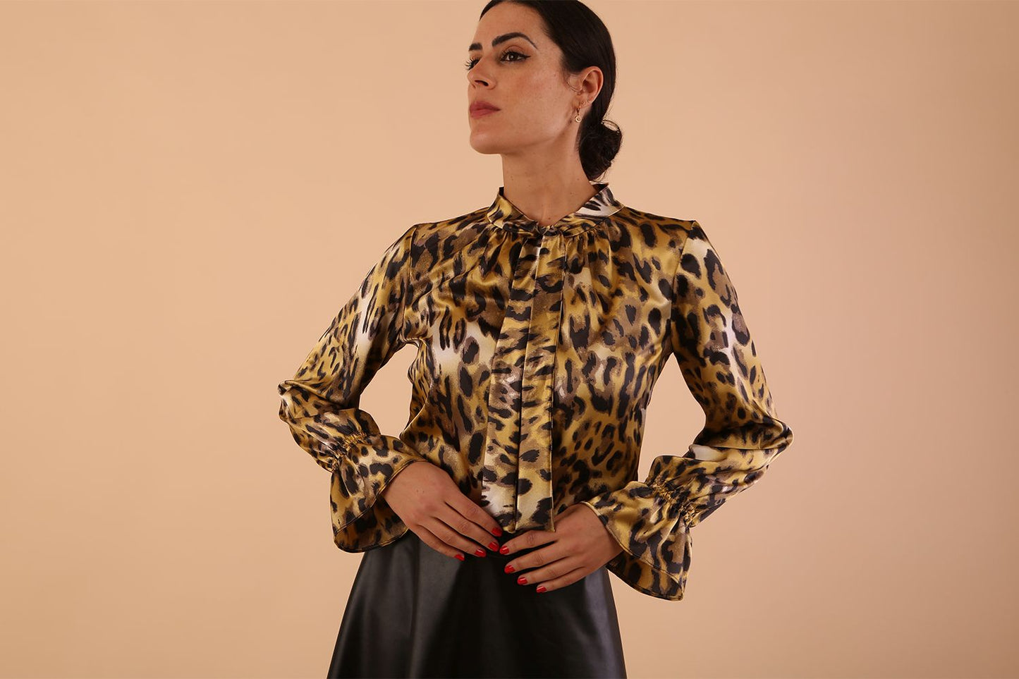 divacatwalk ricky long sleeve animal printed top with a loose tie detail at the front in gold leopard print front