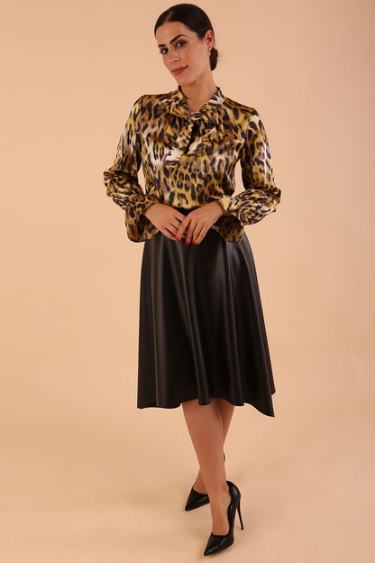 divacatwalk ricky long sleeve animal printed top with a loose tie detail at the front in gold leopard print front