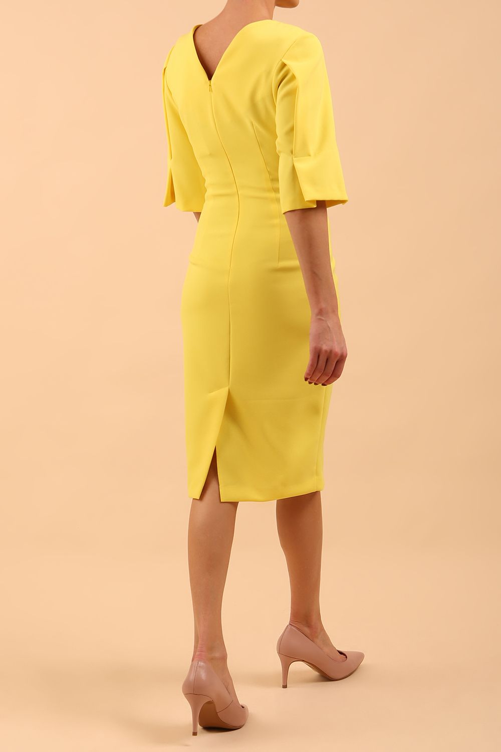model is wearing divacatwalk chiswick pencil dress rounded neck with short sleeve in blazing yellow front side