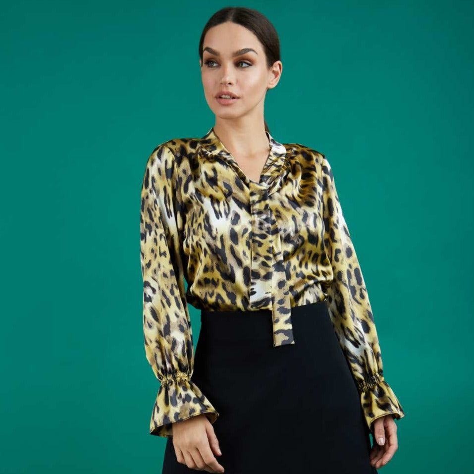 divacatwalk ricky long sleeve animal printed top with a loose tie detail at the front in gold leopard print front