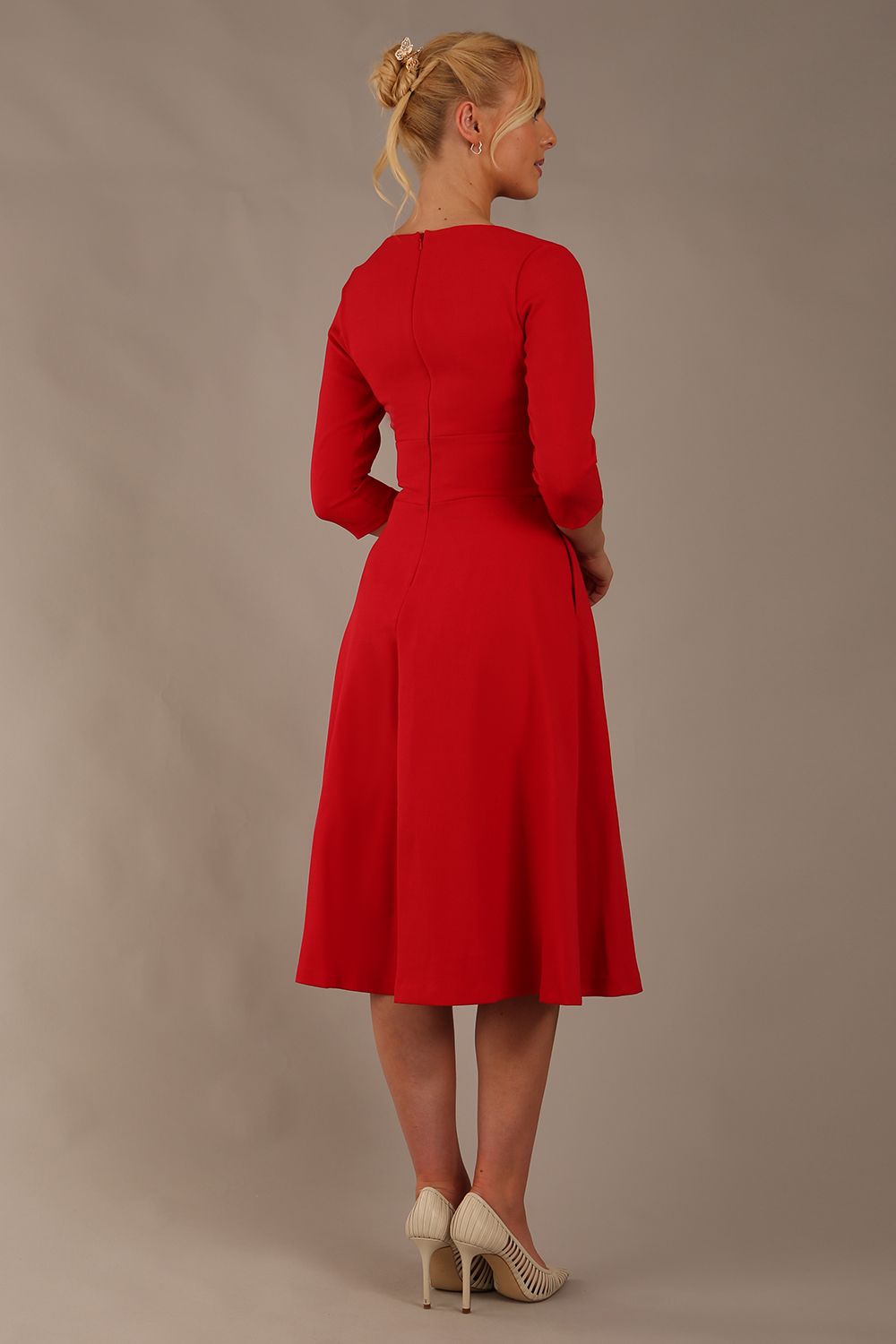 Brunette model is wearing diva catwalk casares swing dress with a keyhole neckline three quarter sleeve dress with pocket detail in red front (Scarlet Red)