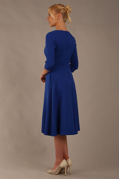 model is wearing diva catwalk casares swing dress with a keyhole neckline three quarter sleeve dress with pocket detail in cobalt blue front (Cobalt Blue)