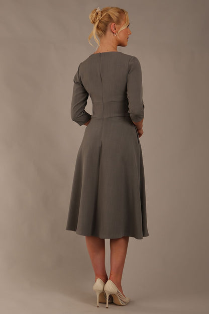 model is wearing diva catwalk casares swing dress with a keyhole neckline three quarter sleeve dress with pocket detail in Castlerock Grey  front (Castlerock Grey)
