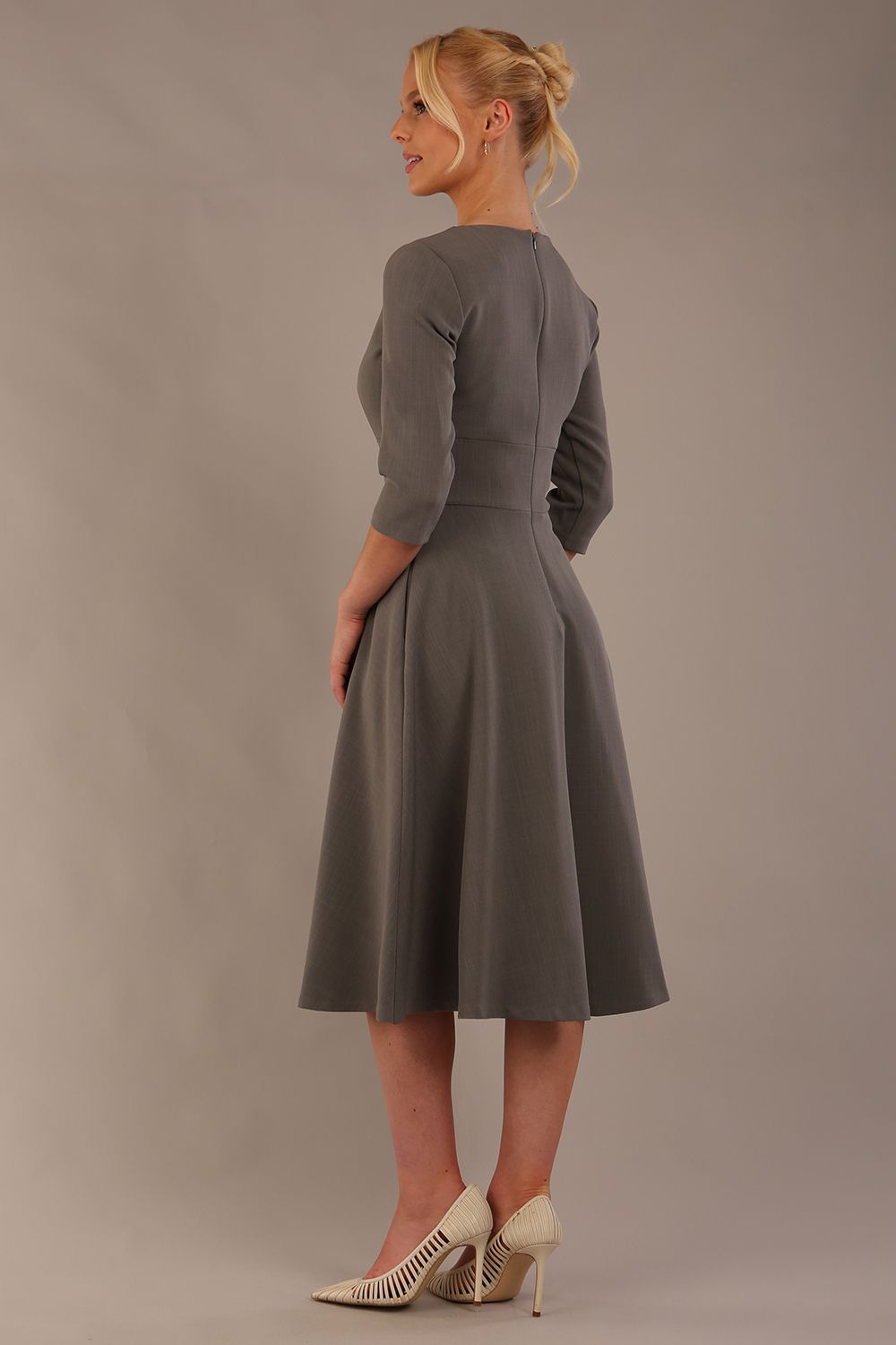 model is wearing diva catwalk casares swing dress with a keyhole neckline three quarter sleeve dress with pocket detail in Castlerock Grey  front (Castlerock Grey)