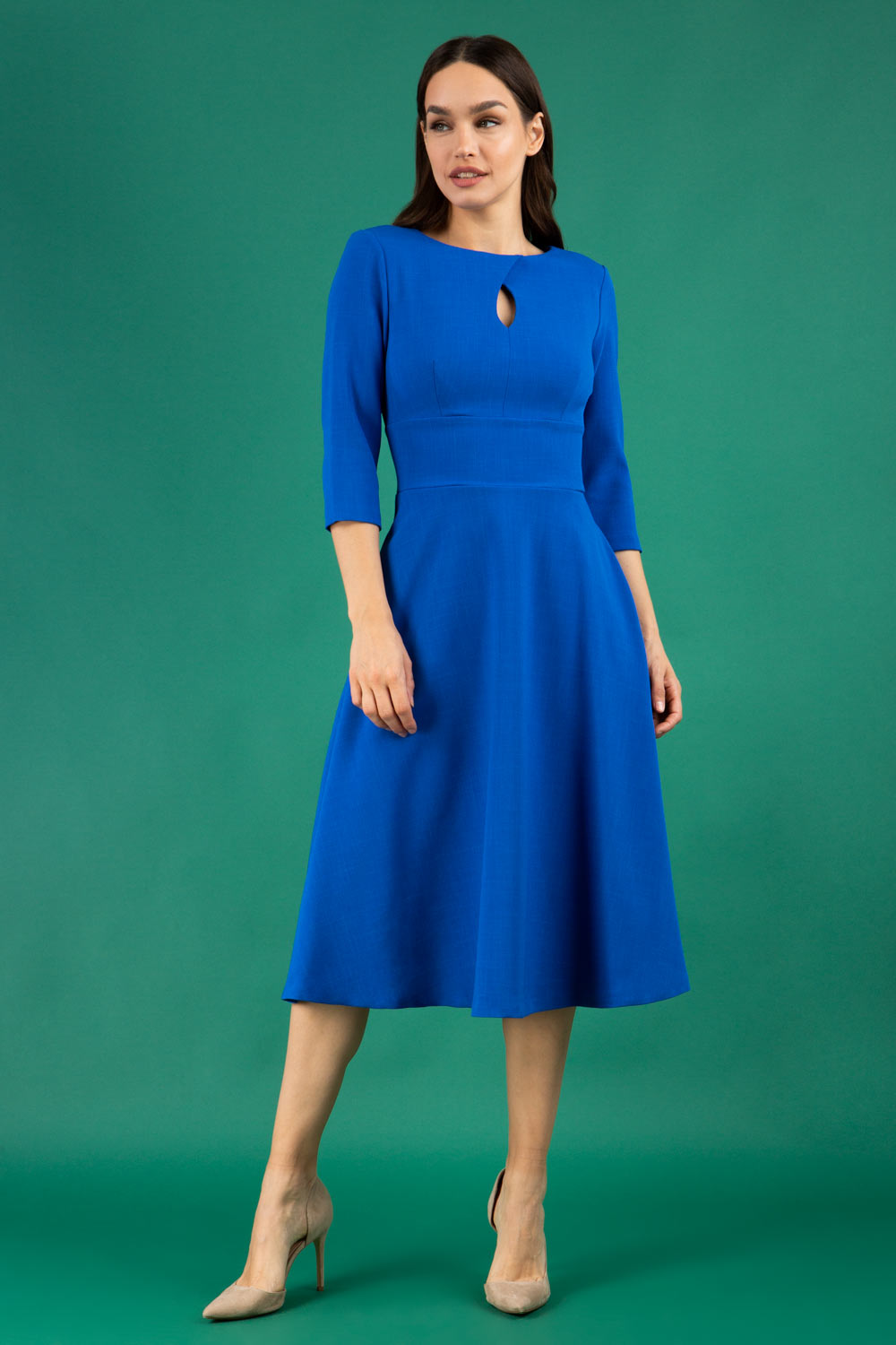 Brunette model is wearing diva catwalk casares swing dress with a keyhole neckline three quarter sleeve dress with pocket detail in cobalt blue front (Cobalt Blue)