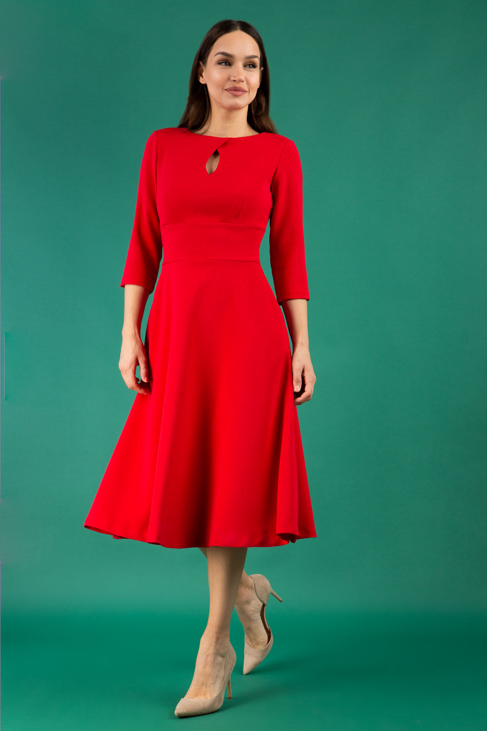 Brunette model is wearing diva catwalk casares swing dress with a keyhole neckline three quarter sleeve dress with pocket detail in red front (Scarlet Red)