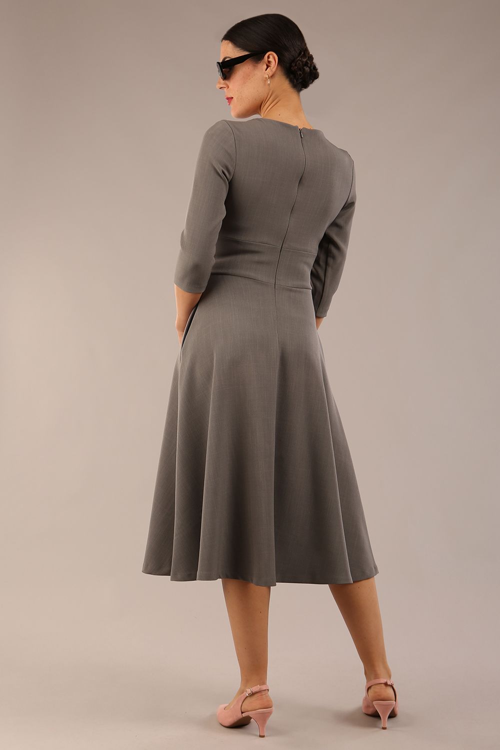 model is wearing diva catwalk casares swing dress with a keyhole neckline three quarter sleeve dress with pocket detail in Castlerock Grey  front (Castlerock Grey)