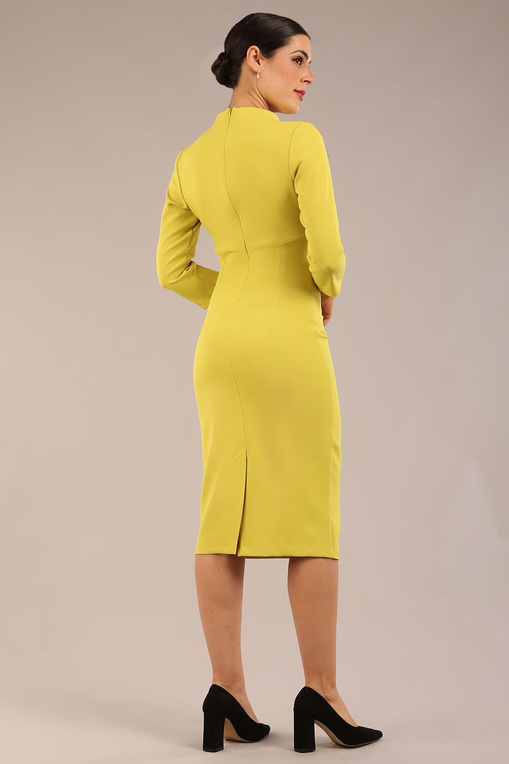 model is wearing diva catwalk plaza sheath dress with high neck Trapezium neckline cutout and three quarter sleeve pretty dress in citrus green front