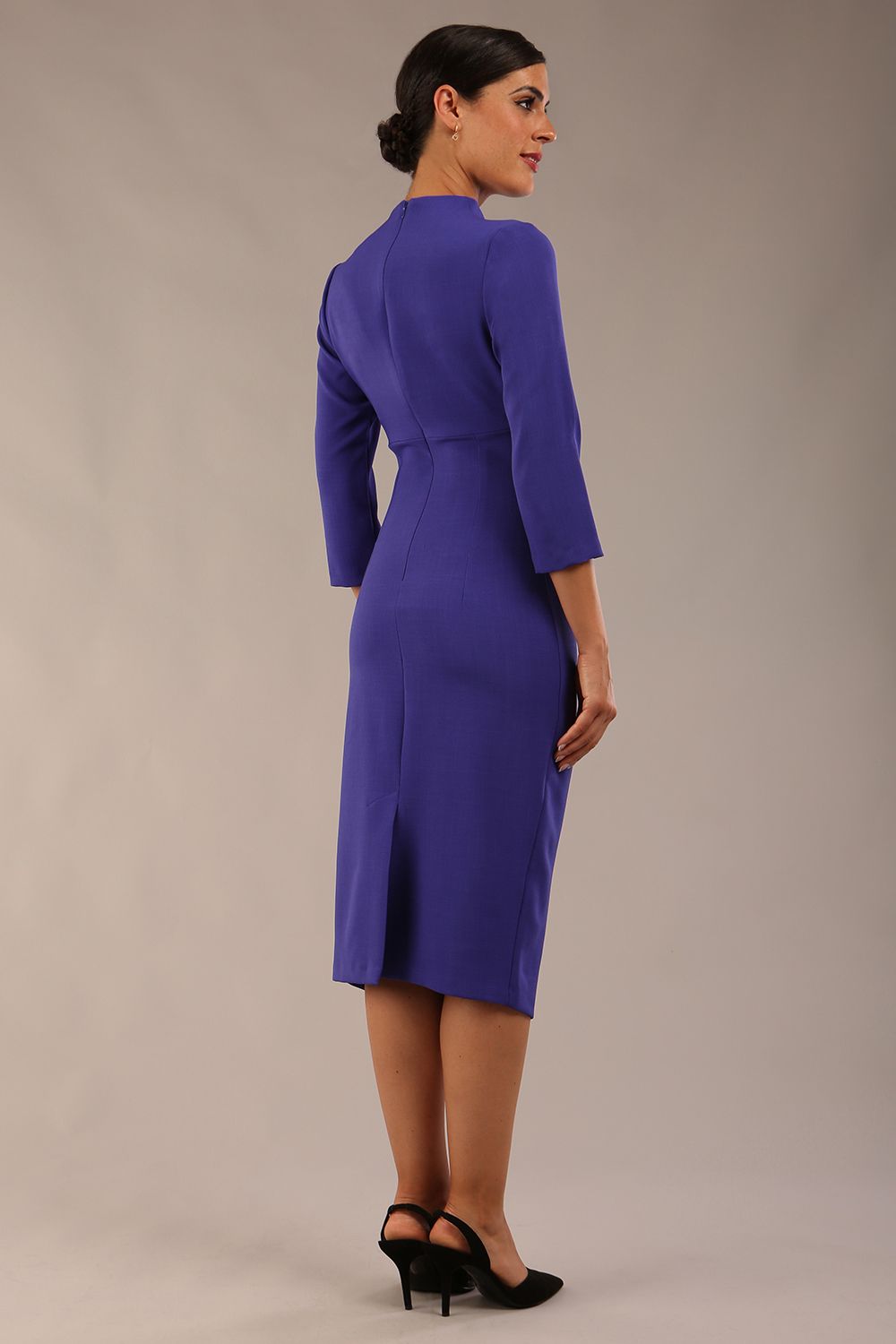 model is wearing diva catwalk plaza sheath dress with high neck Trapezium neckline cutout and three quarter sleeve pretty dress in Indigo blue front