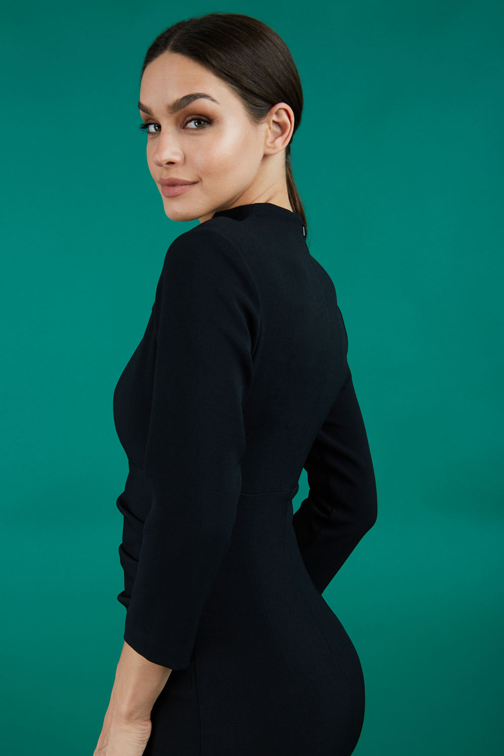 model is wearing diva catwalk plaza sheath dress with high neck Trapezium neckline cutout and three quarter sleeve pretty dress in black front