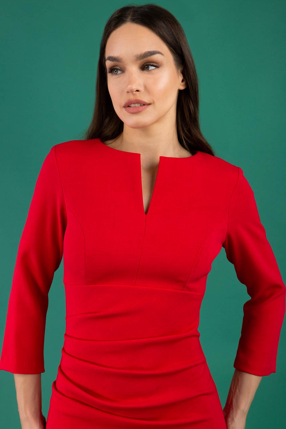 model is wearing diva catwalk chandos sheath dress with three quarter sleeve and slit in the middle of the neckline in scarlet red front