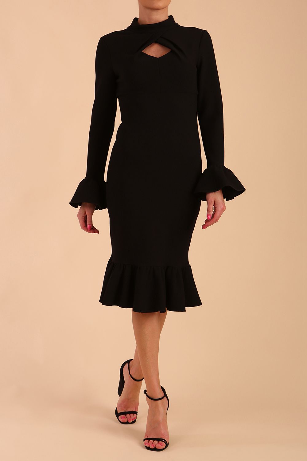 Model wearing Macarena Peplum Hem Bodycon Pencil Dress with Long sleeves with peplum details at the ends and High neckline with overlapping keyhole detail in Black colour front side