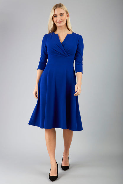 blonde model is wearing diva catwalk january sleeved a-line v-neck dress in royal blue front